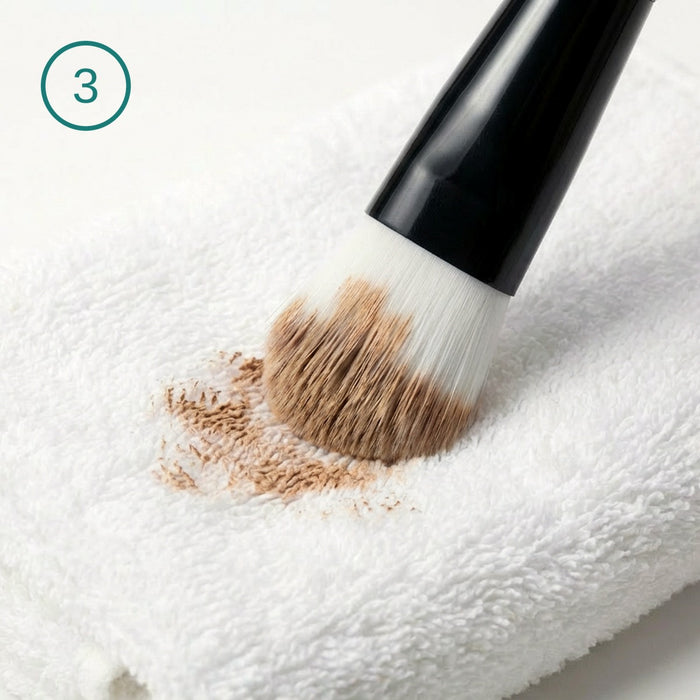 Wipe on a towel until the makeup lifts off.